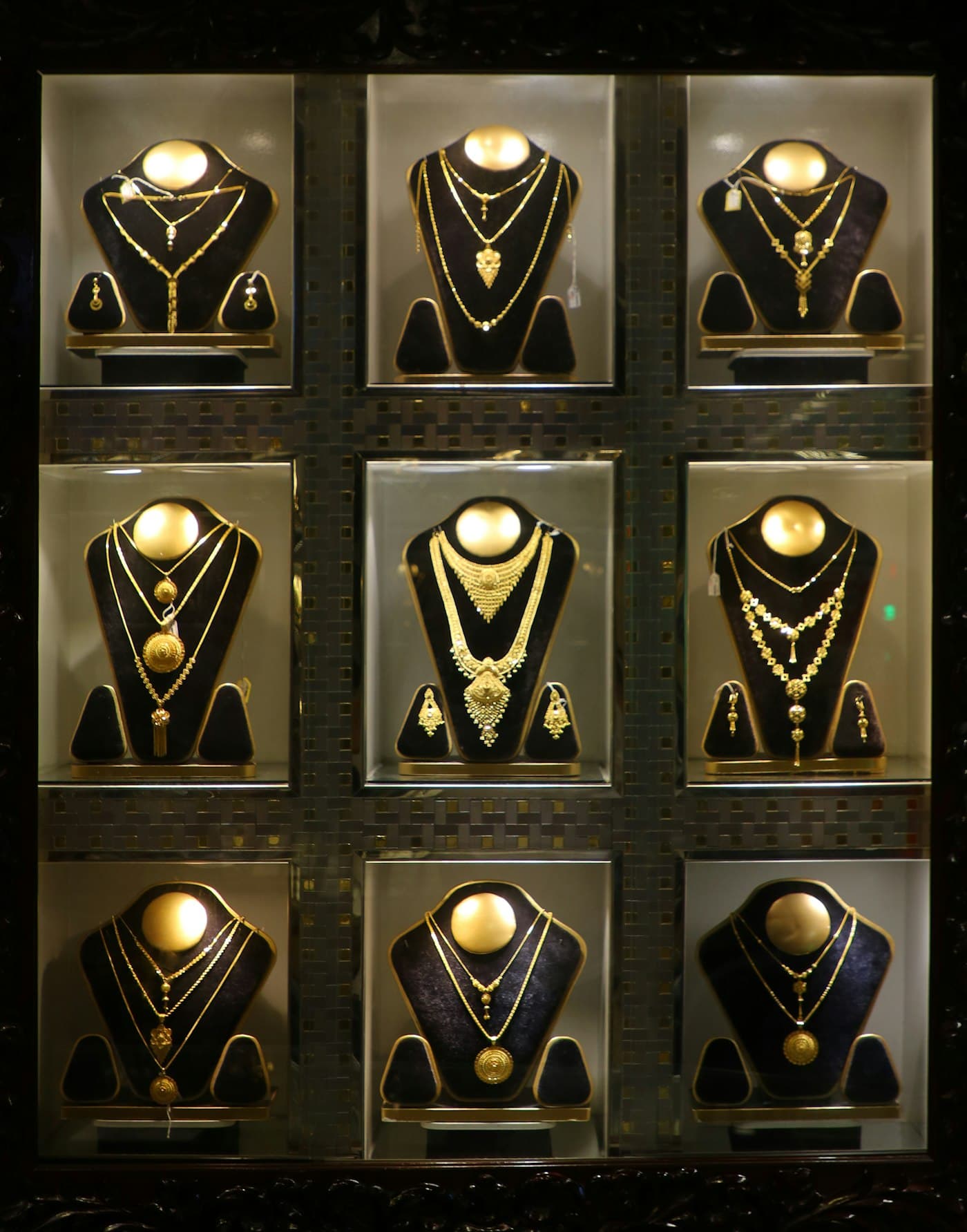 Gold bridal necklace sets on display in-store